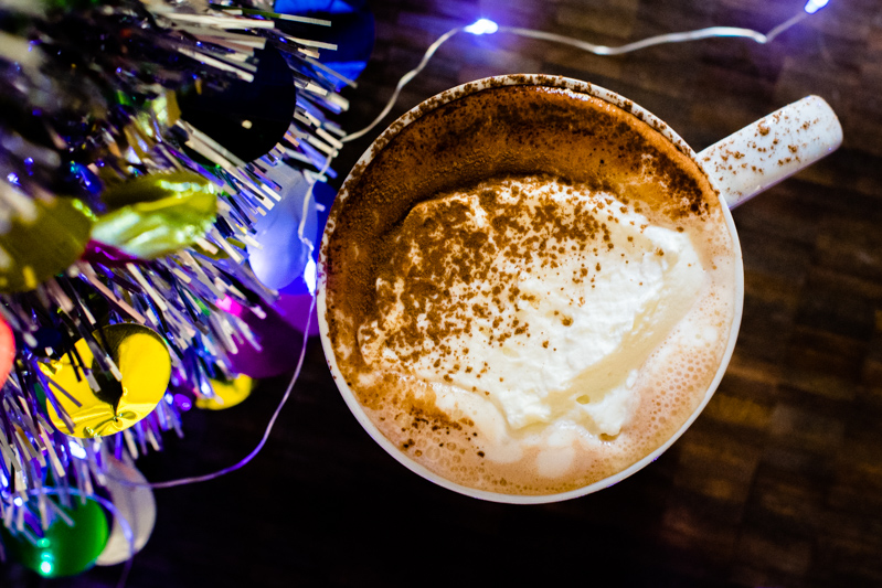 overhead hot cocoa with whipped cream and cocoa powder