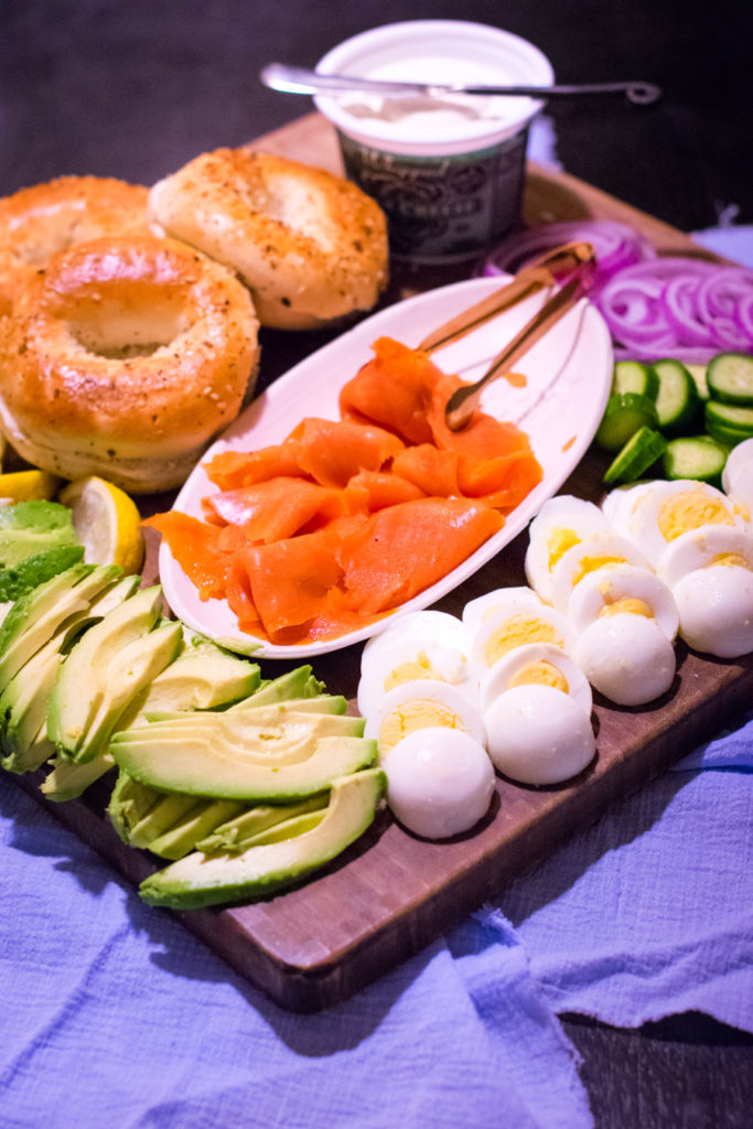 Platter with bagels, lox, and various accompaniments. 
